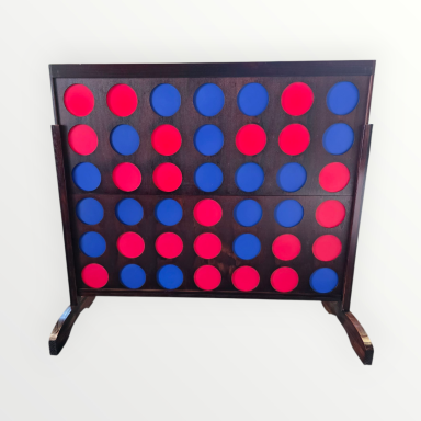 4-gewinnt Ein Spielbrett für Vier Gewinnt mit roten und blauen Steckern.